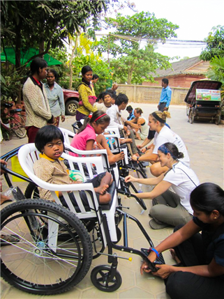 Volunteers assitsing special needs patients