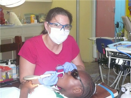 Dentist treating Jamaican patient