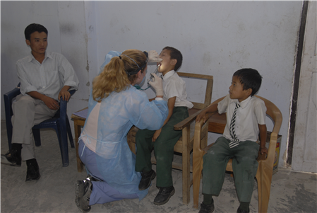 Dentist examining patients in waiting area