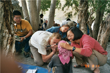 Dentist conducting exam amongst trees