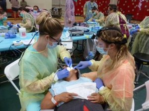 Dentists treating patient