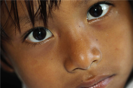 A close-up photo of a small child's face
