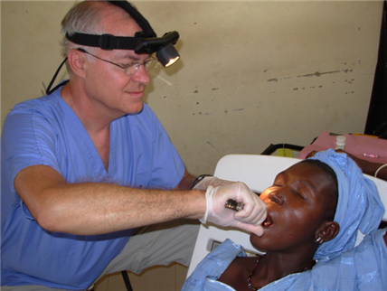 Photo of patient receiving dental care from a volunteer dentist