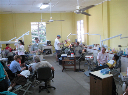 Photo of tidy dental clinic with six operatories