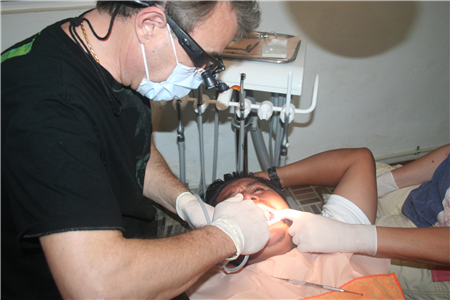 Photo of person receiving dental treatment in a clinic