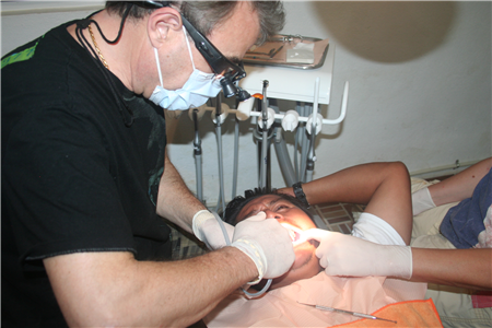 Photo of person receiving dental treatment in a clinic 