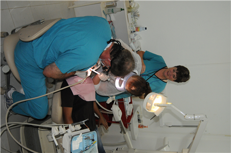 Dentists treating patient in Belize clinic