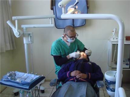Photo of person providing dental care in a clinic setting