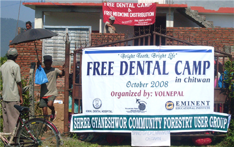 Photo of the outside of a building with free dental camp banners